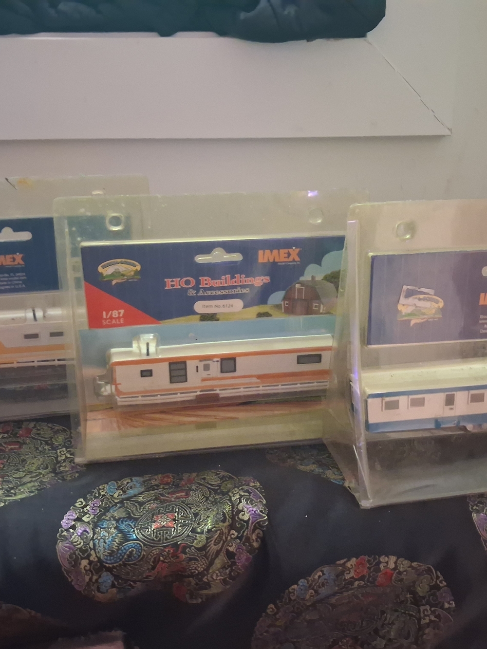 This is 3 Imex Models Company 1958 Skyline Trailer model kit in HO 1:87 scale.